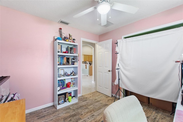 interior space featuring ceiling fan and hardwood / wood-style flooring