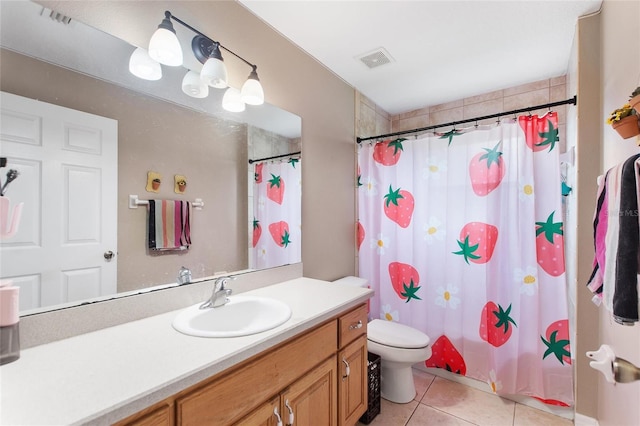 bathroom with toilet, vanity, a shower with curtain, and tile patterned floors