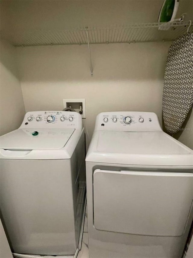 laundry room featuring separate washer and dryer