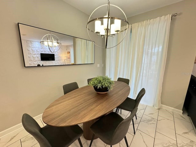 dining area featuring a notable chandelier