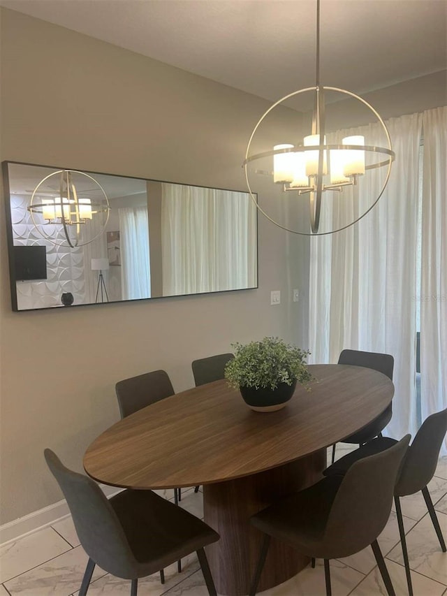 dining room featuring a chandelier