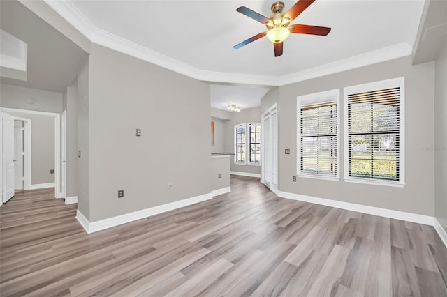 unfurnished living room with ceiling fan, crown molding, and light hardwood / wood-style floors