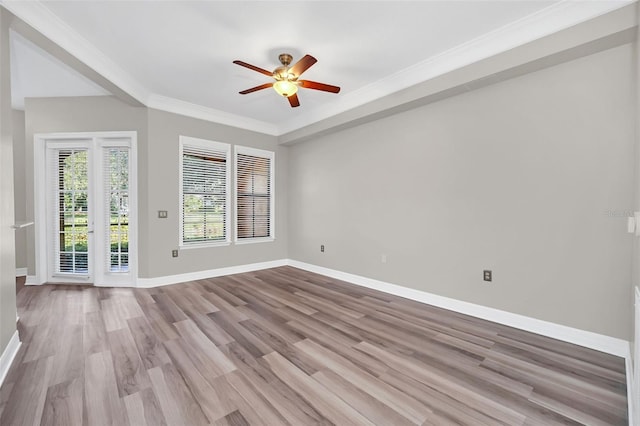 unfurnished room featuring ceiling fan, light wood-type flooring, and crown molding