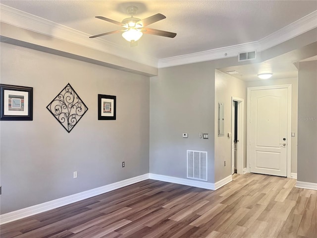 unfurnished room with ceiling fan, crown molding, a textured ceiling, and light hardwood / wood-style floors