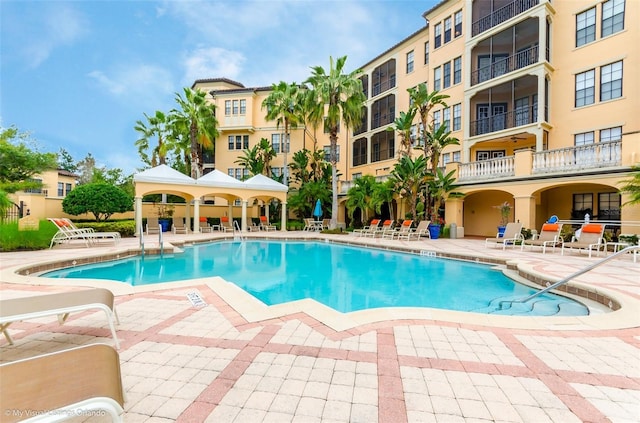 view of swimming pool with a patio area