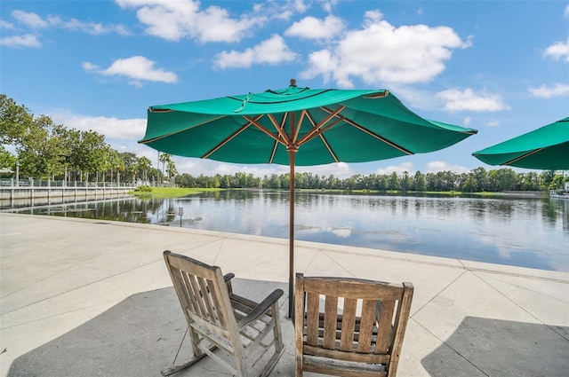 view of patio featuring a water view