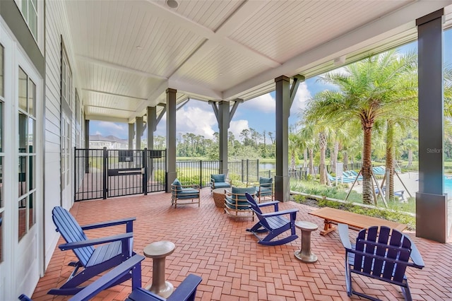 view of patio with a water view