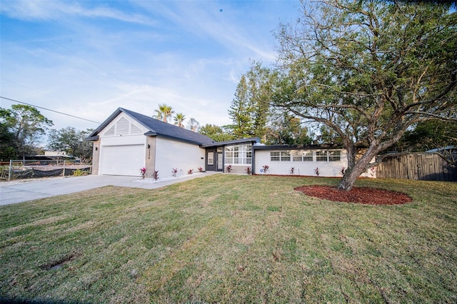 single story home with a garage and a front yard