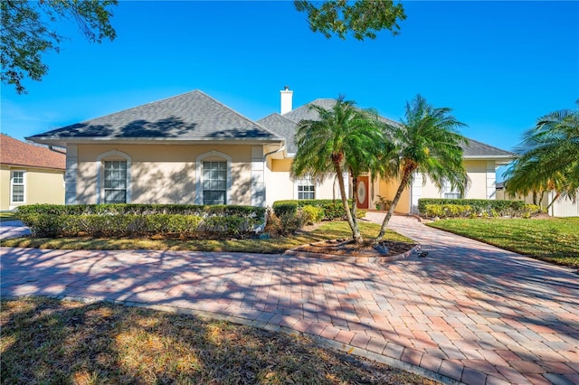 view of front of home with a front lawn