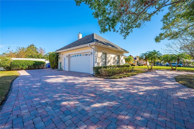 view of side of property featuring a garage