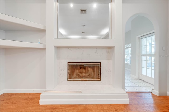 details with a fireplace and hardwood / wood-style flooring