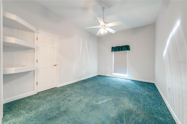 empty room with ceiling fan and carpet flooring