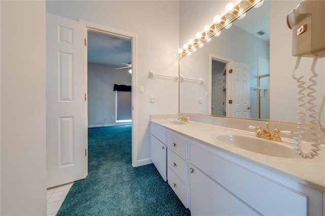 bathroom with ceiling fan, tile patterned flooring, and vanity