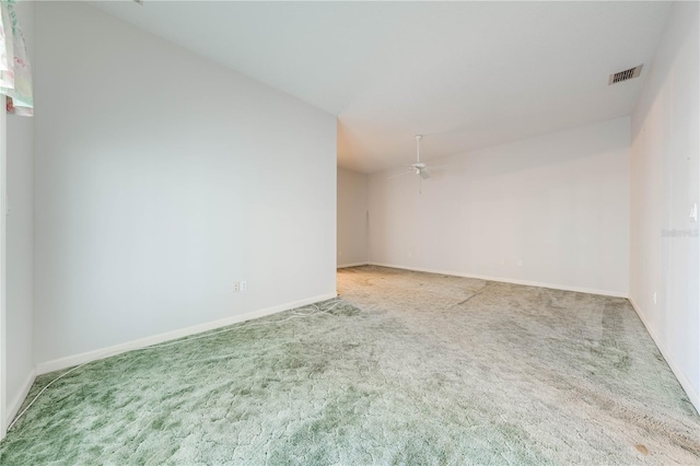 carpeted empty room featuring ceiling fan