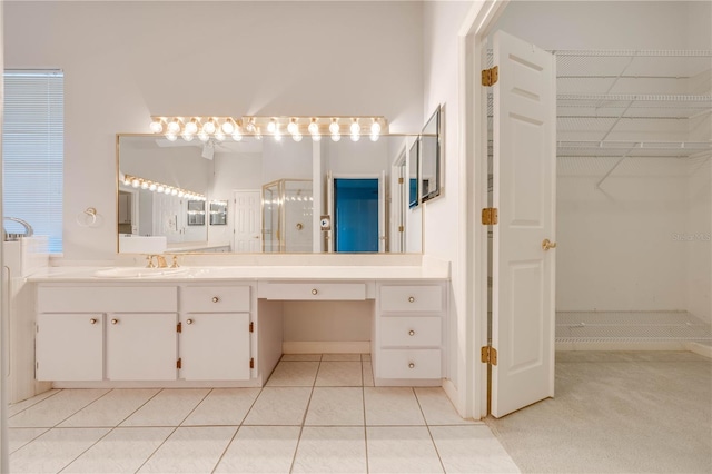 bathroom with tile patterned floors and vanity