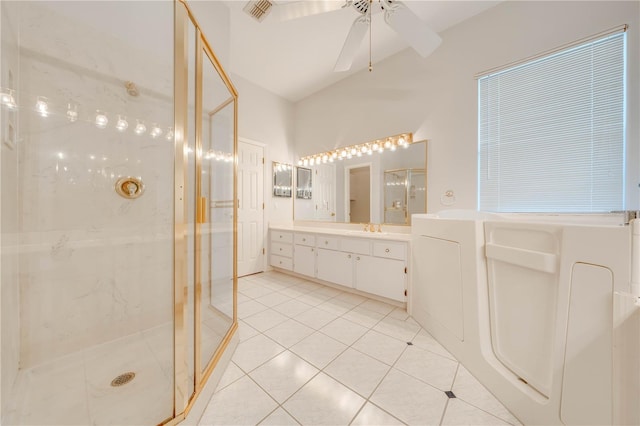 bathroom featuring ceiling fan, vanity, tile patterned flooring, and a shower with door