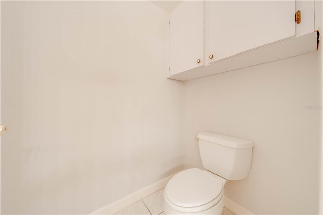 bathroom featuring toilet and tile patterned floors