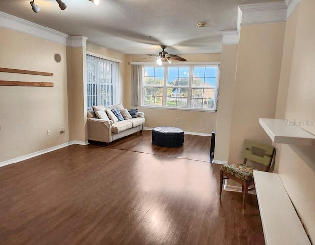 unfurnished living room with ceiling fan, dark hardwood / wood-style flooring, and ornamental molding