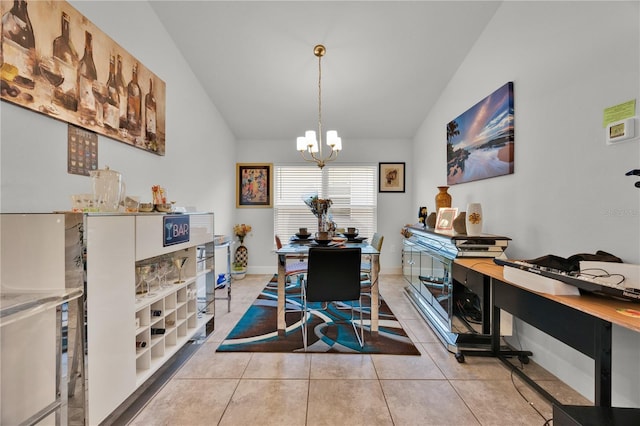 dining room with lofted ceiling, light tile patterned floors, baseboards, and an inviting chandelier