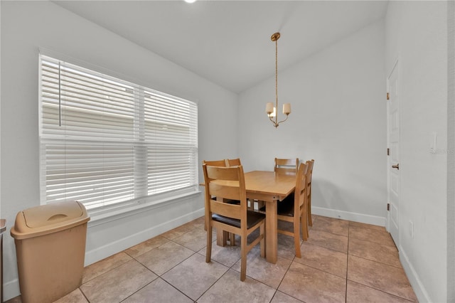 dining room with a notable chandelier, baseboards, and light tile patterned floors