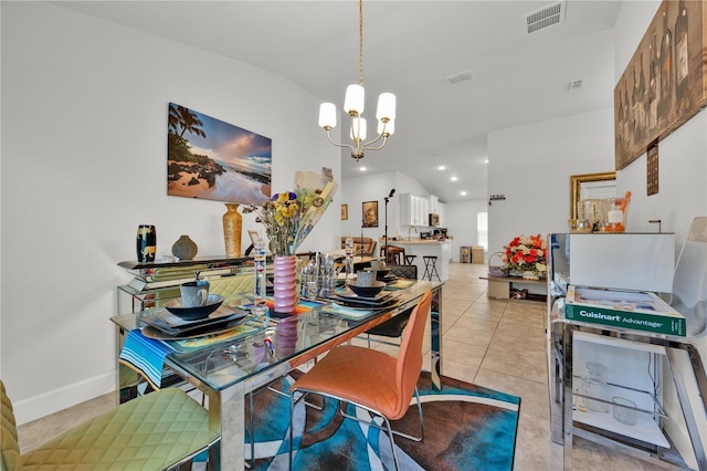 dining room featuring light tile patterned floors, vaulted ceiling, visible vents, and an inviting chandelier