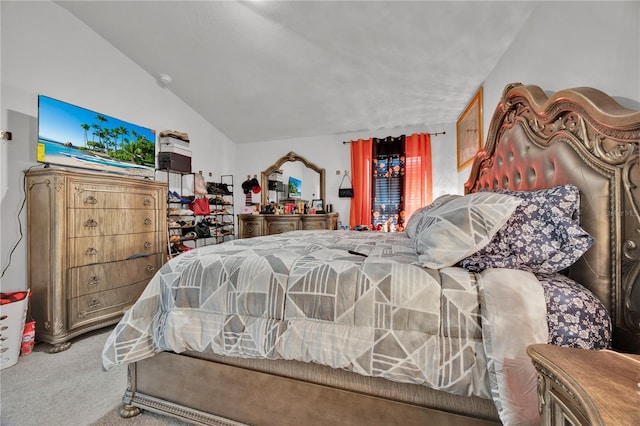 bedroom featuring carpet flooring and vaulted ceiling