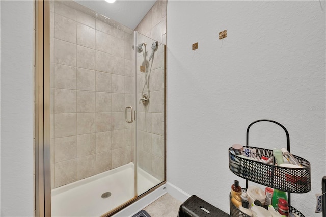 bathroom featuring a shower stall