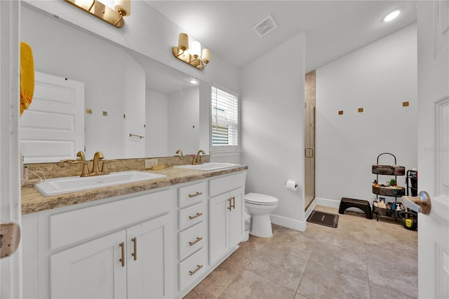 full bathroom featuring a stall shower, tile patterned flooring, visible vents, and a sink