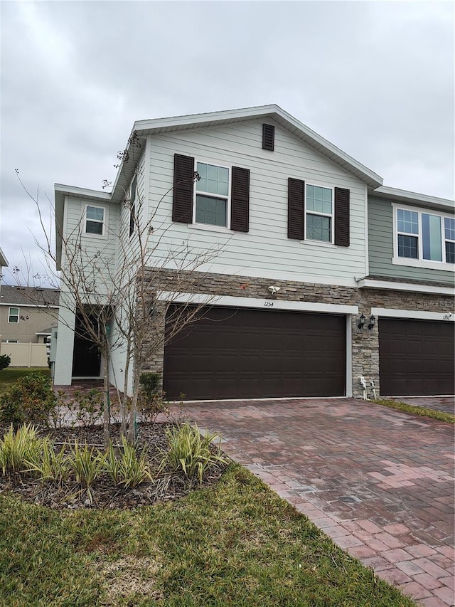 view of front of property with a garage