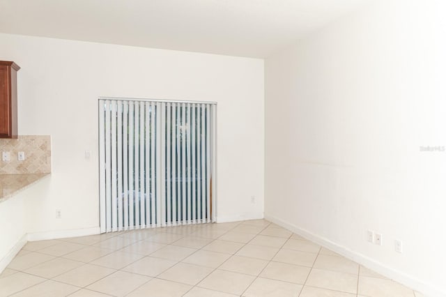 view of tiled spare room