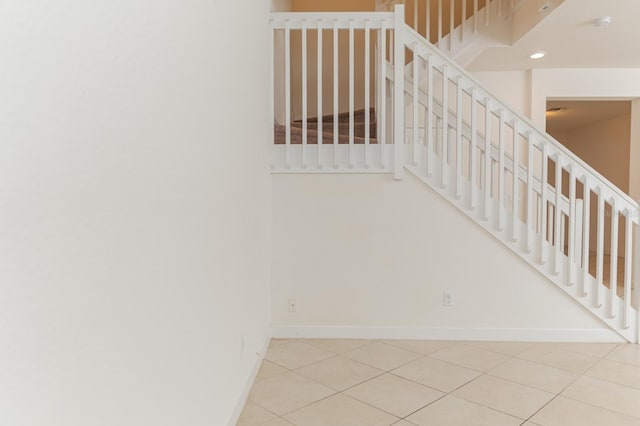 stairs with tile patterned flooring