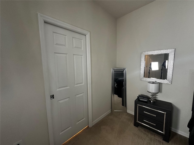 interior space featuring dark colored carpet