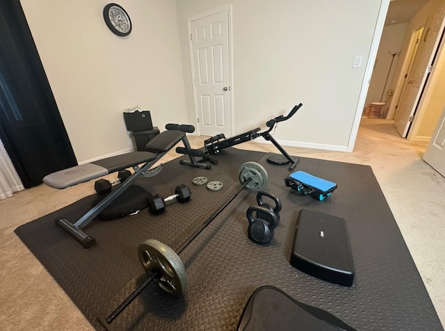 workout area featuring light colored carpet