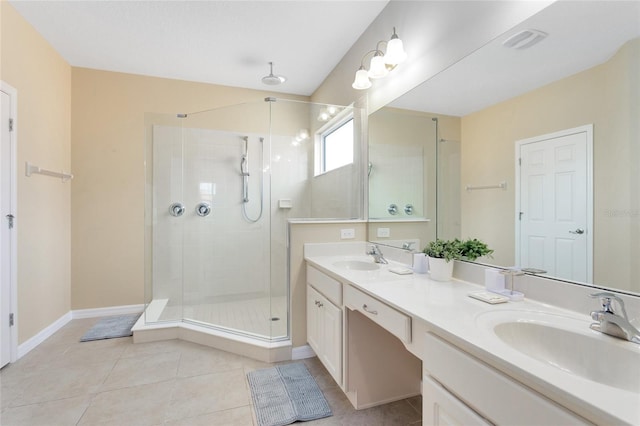 bathroom with vanity, walk in shower, and tile patterned floors