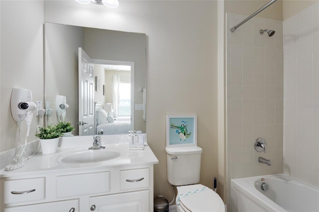 full bathroom featuring vanity, toilet, and tiled shower / bath combo