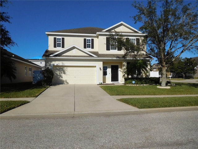 front facade with a front lawn and a garage