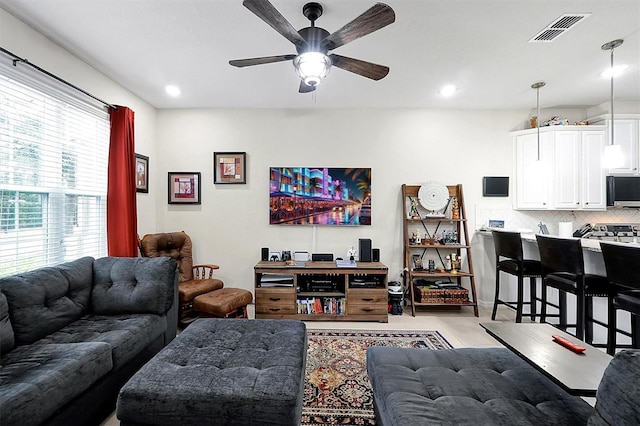 living room with ceiling fan