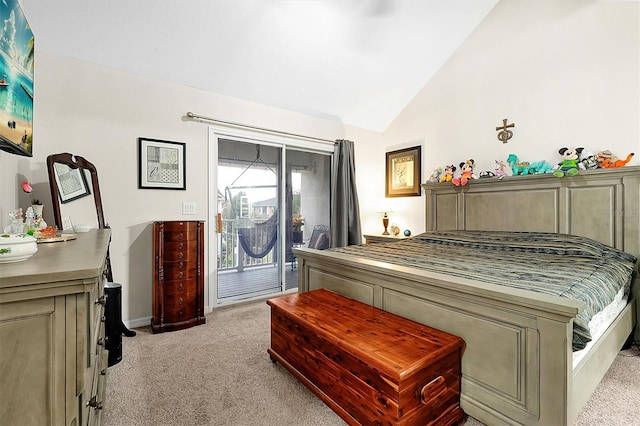 bedroom featuring access to exterior, lofted ceiling, and light carpet