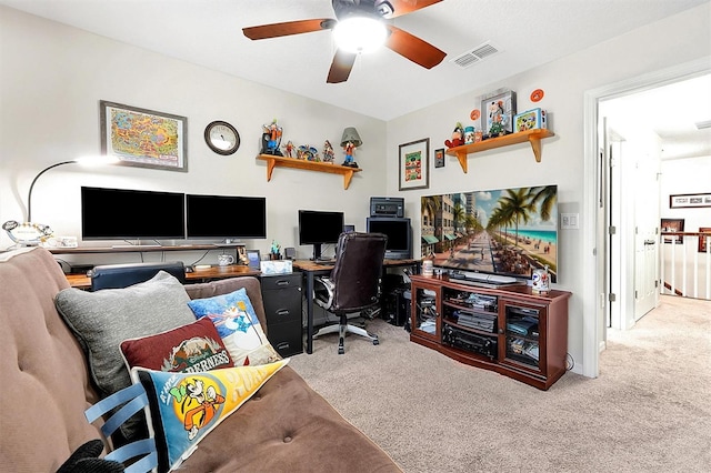 home office featuring light colored carpet and ceiling fan