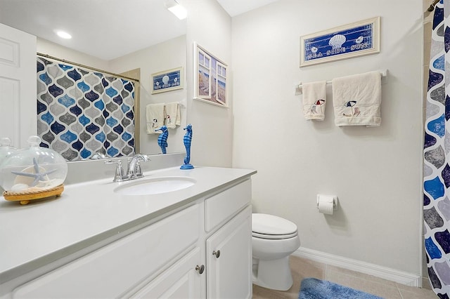 bathroom with vanity, toilet, and tile patterned floors