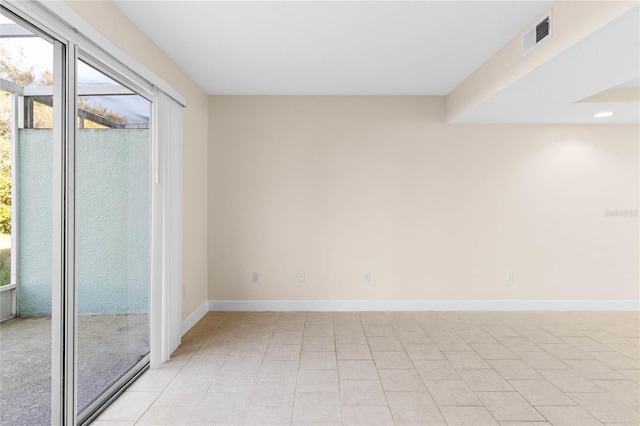 empty room with light tile patterned floors