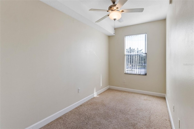 empty room featuring light carpet and ceiling fan