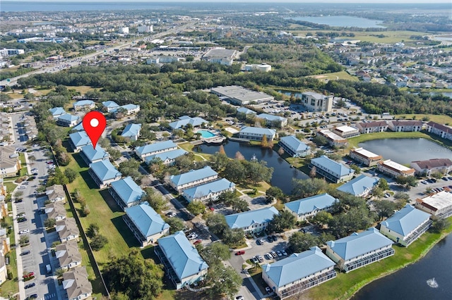 birds eye view of property featuring a water view