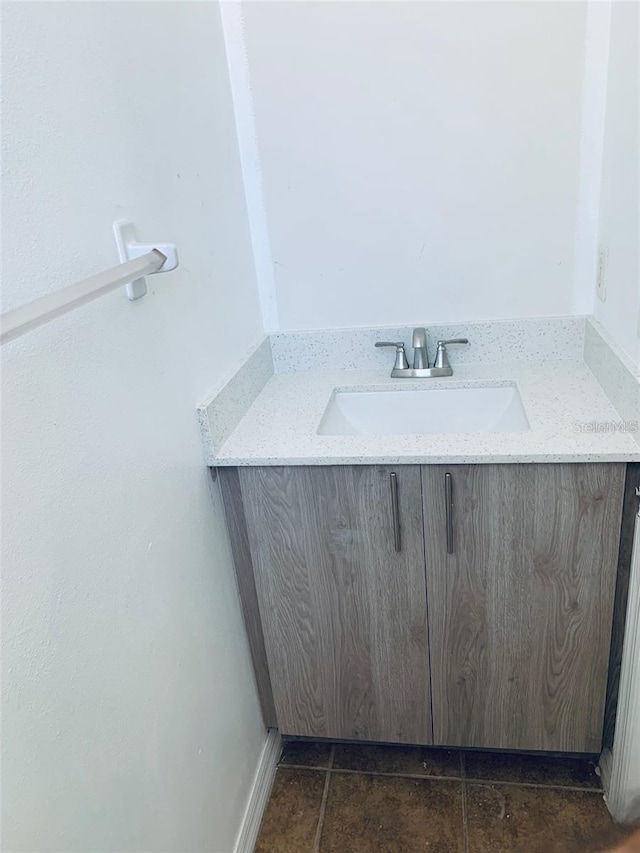 bathroom with vanity and tile patterned flooring