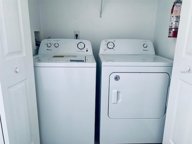 washroom with separate washer and dryer