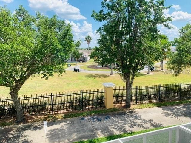 view of home's community featuring a lawn