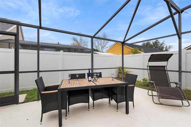 view of patio featuring a lanai