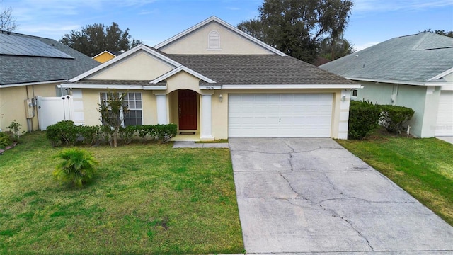 ranch-style house with a front lawn and a garage