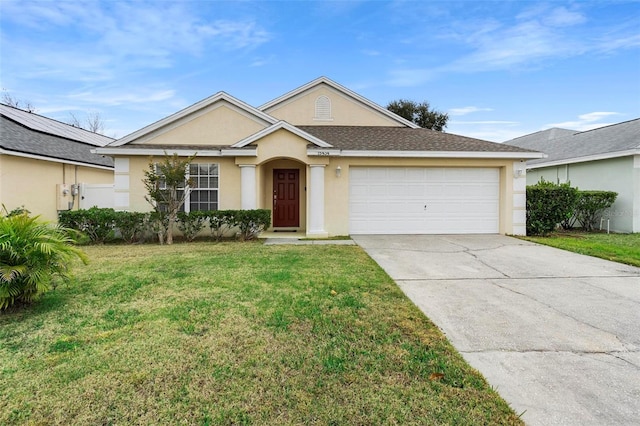 ranch-style house featuring a garage and a front yard