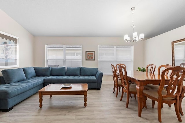 interior space featuring an inviting chandelier and light hardwood / wood-style flooring